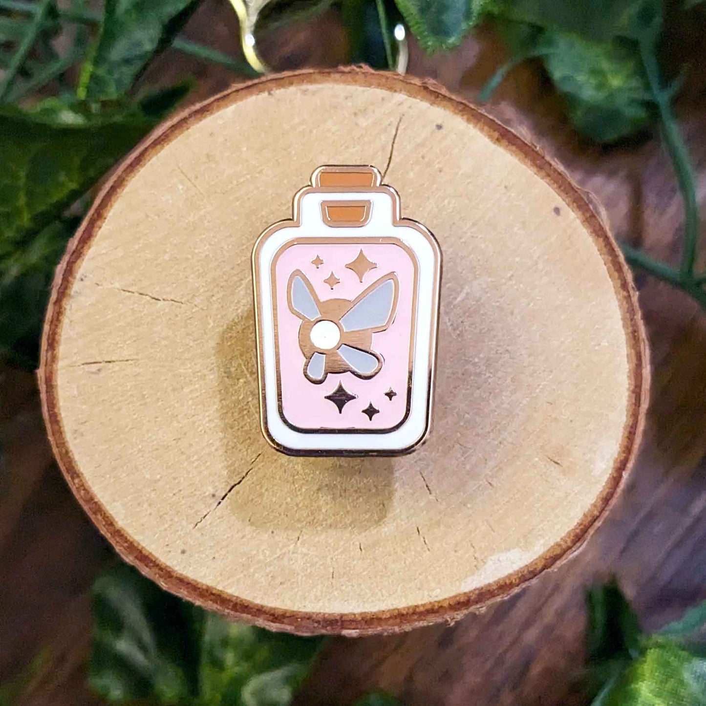 Glow in the dark pink fairy in a rectangular bottle enamel pins.