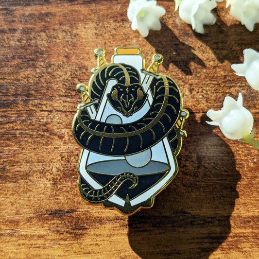 Black snake skull and body wrapped around a potion bottle with swords enamel pin