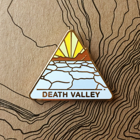 Triangle Death Valley national park enamel pin featuring a view of Badwater Basin..