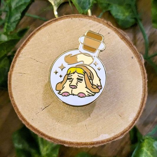 Cute brown dog with pink paws in a bottle enamel pin designed by EXP Gained