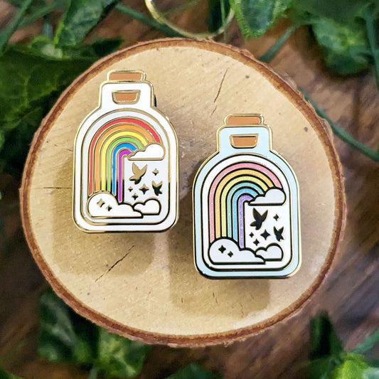 Classic rainbow and glitter rainbow with butterflies in a bottle enamel pins