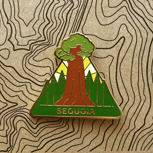 Triangle Sequoia national park enamel pin featuring a view of the famous General Sherman Sequoia tree with a perspective from the base..