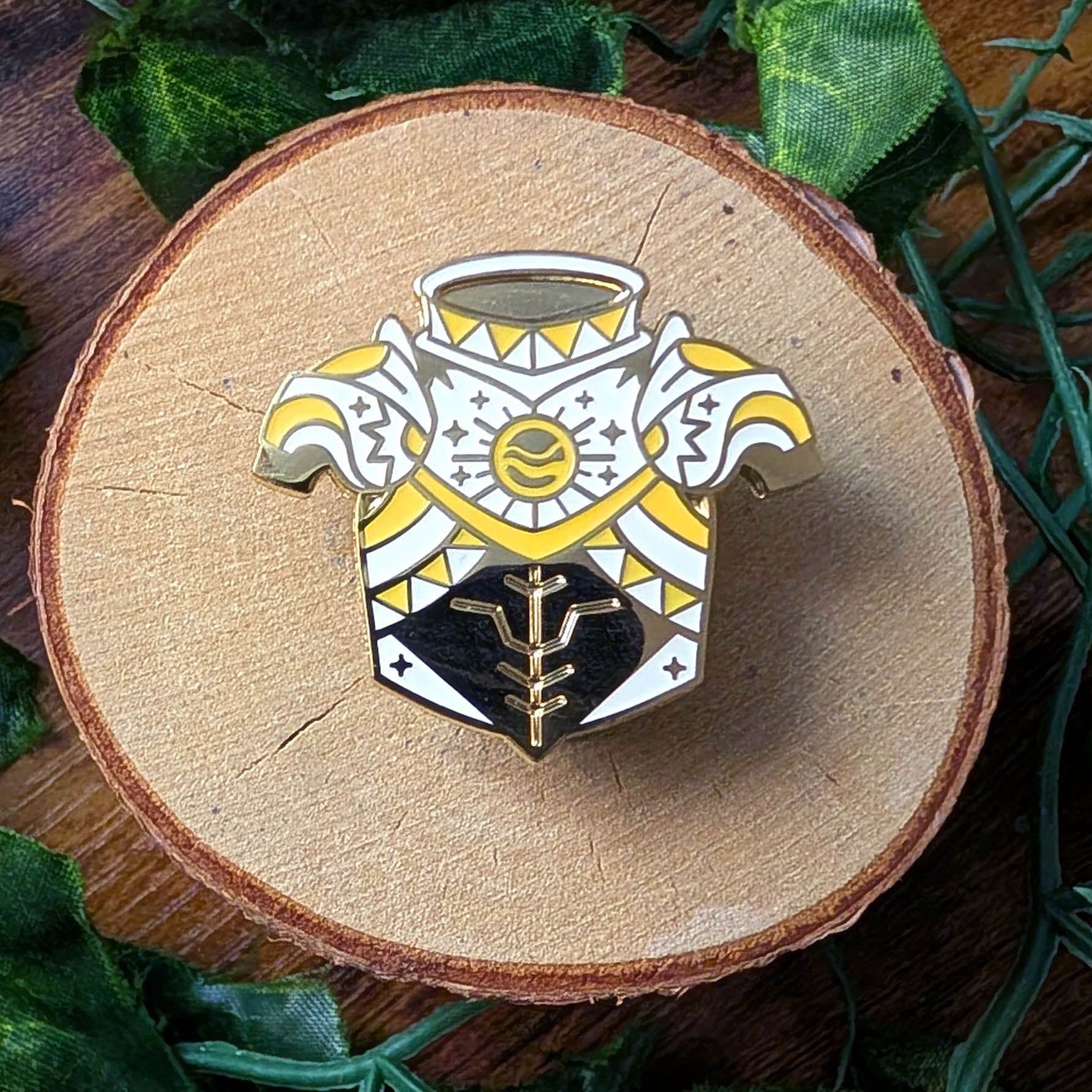 gold yellow and white sun armor enamel pin design