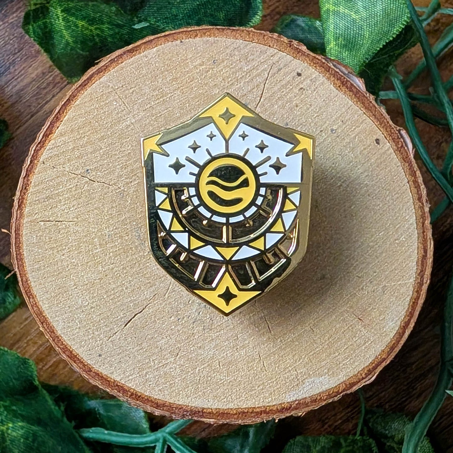 gold yellow and white sun shield enamel pin design
