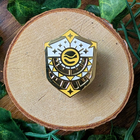 gold yellow and white sun shield enamel pin design