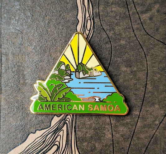 Triangle American Samoa national park enamel pin featuring a view of Pola Island.