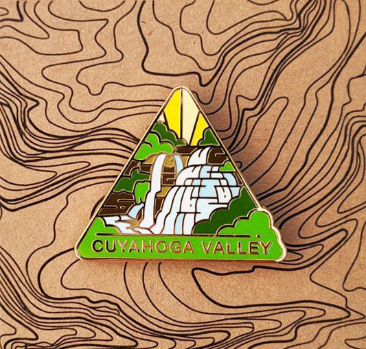 Triangle Cuyahoga Valley national park enamel pin featuring a view of Brandywine Falls.