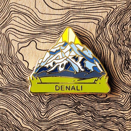  Triangle Denali national park enamel pin featuring a view of Denali mountain.