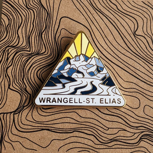 Triangle Wrangell-St. Elias national park enamel pin featuring a view of Mt. Blackburn and the glacier striations.